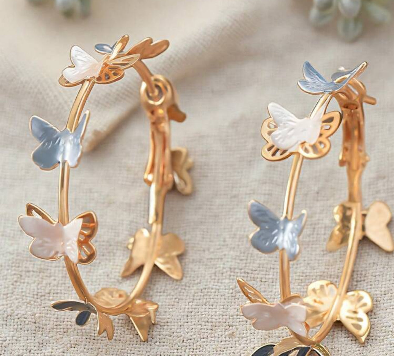 White and blue butterfly earrings