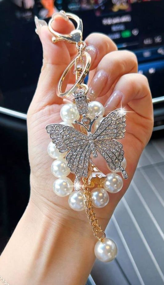 Silver butterfly, pearlbracelet and keychain