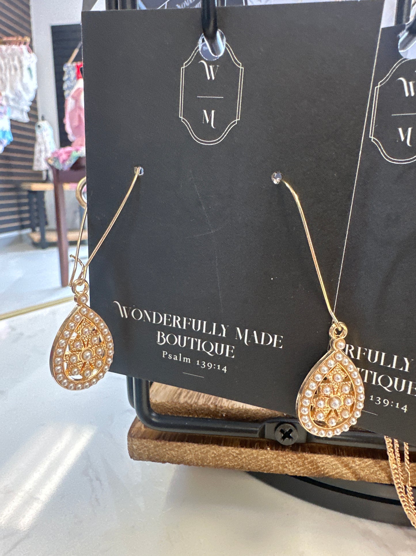 Long dangling earrings with design