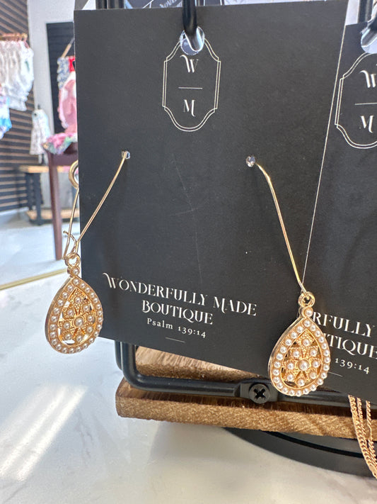 Long dangling earrings with design