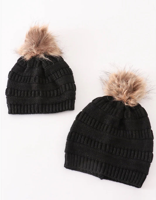 Girl and adult black pompom beanie
