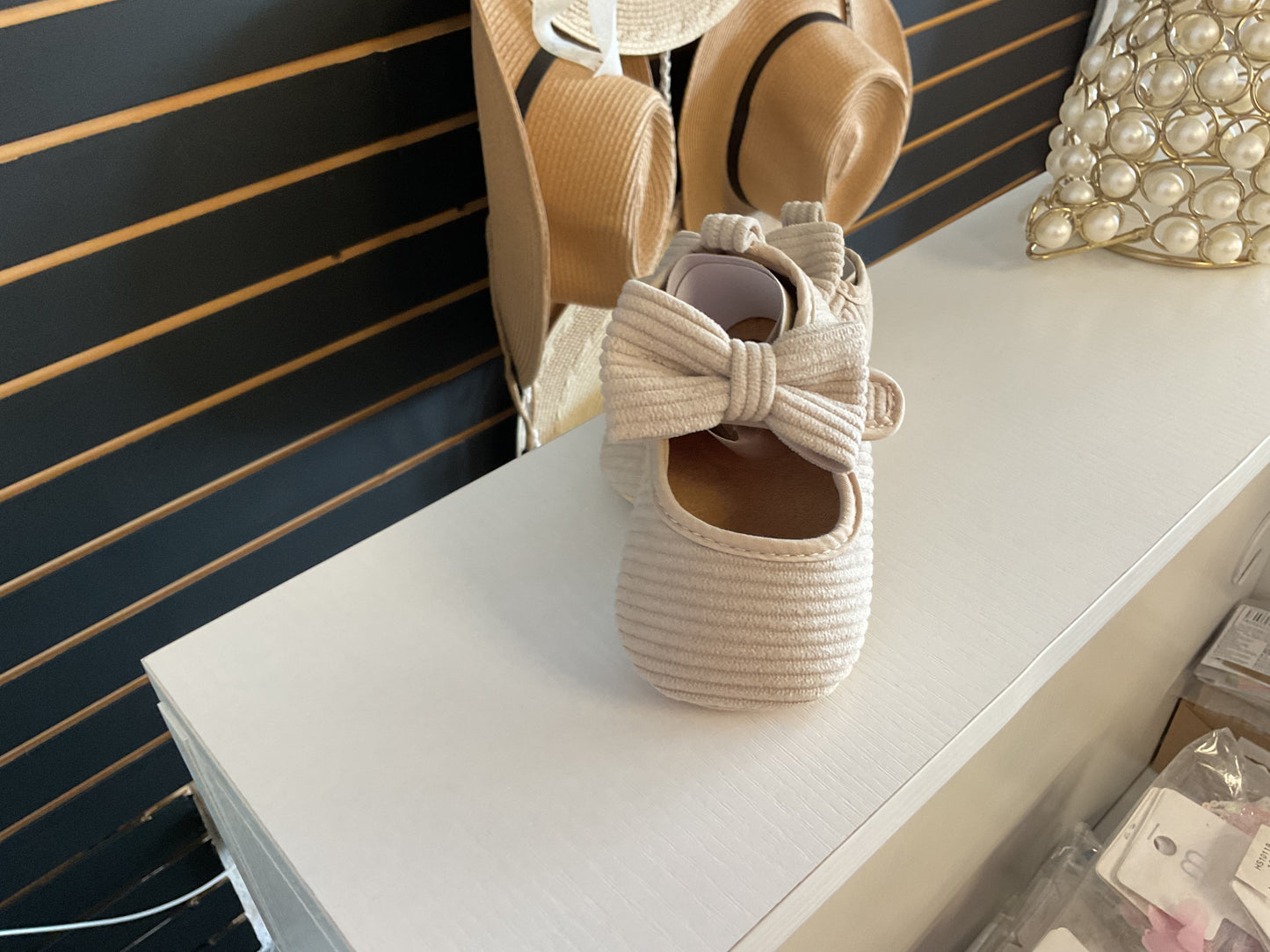 Off white baby shoes
