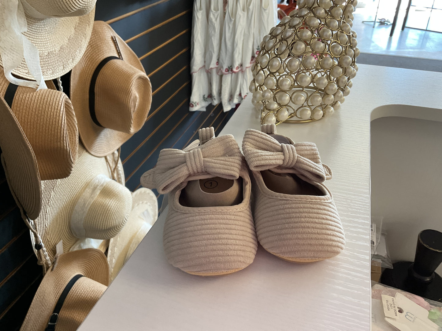 Off white baby shoes