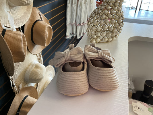 Off white baby shoes