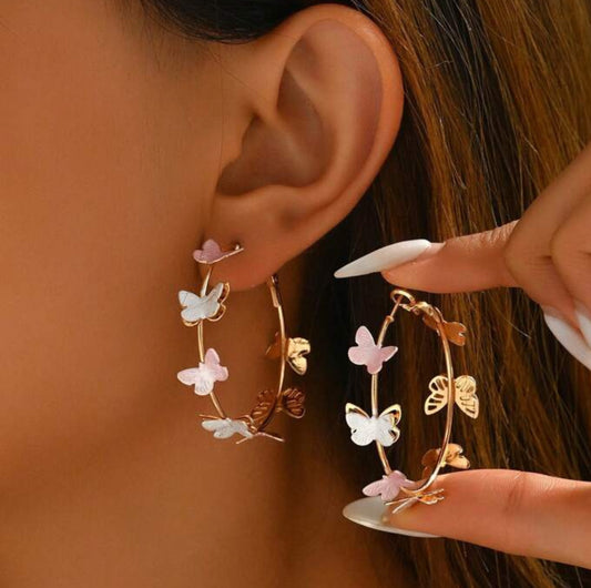 Pink and white hoop butterfly earrings