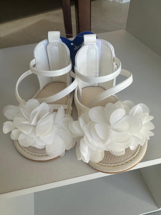 White flower baby shoes