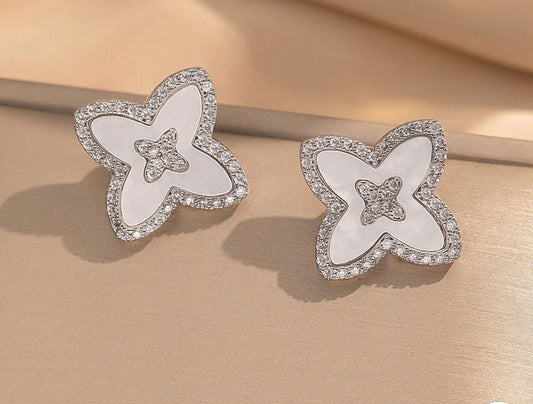 White and silver earrings