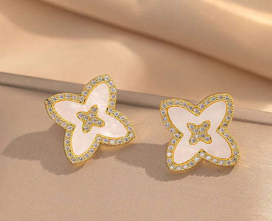 White earrings with gold